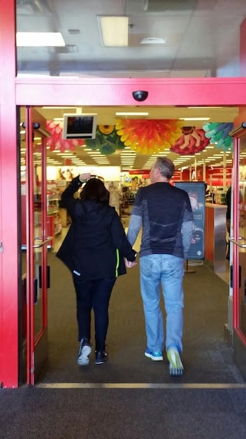 A crowded arcade scene from the 1980s, filled with people playing various arcade games, neon lights illuminating the room, and a sense of excitement and community in the air.