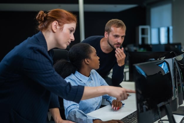 A group of diverse professionals participating in a cybersecurity training session, with a presentation on identifying phishing emails projected on a screen.