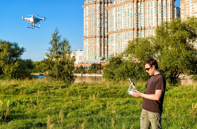 A drone flying over a smart city, capturing data and transmitting information in real-time, showcasing the use of 5G in urban monitoring and management.